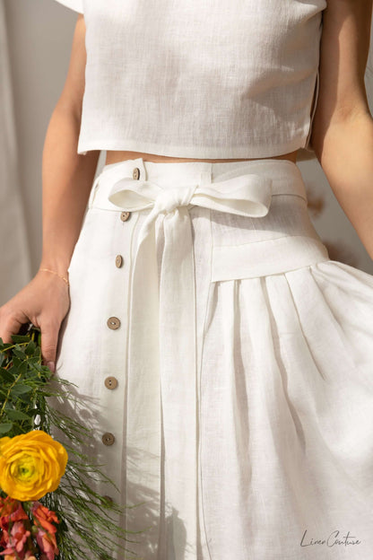 Taormina Set | Linen Crop Top and Flared Midi Skirt featuring a cropped top and a flared skirt with button details.