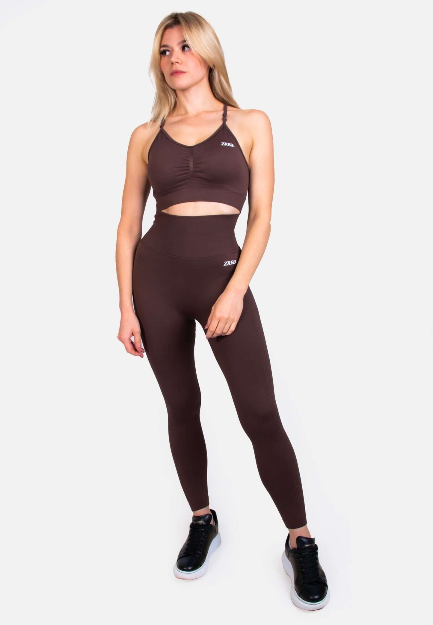 Model wearing Shape Seamless Sports Bra paired with matching leggings, showcasing style and support for workouts.
