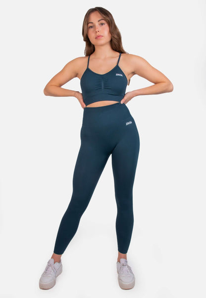 Model wearing Shape Seamless Sports Bra with leggings, showcasing optimal support for training.