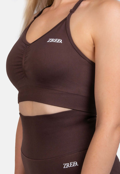 Shape Seamless Sports Bra in brown, featuring adjustable straps and removable pads for personalized support.